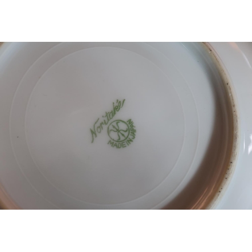 463 - Noritake of Japan, a thirty-eight piece bone china tea set decorated with Indian scenes depicting an... 
