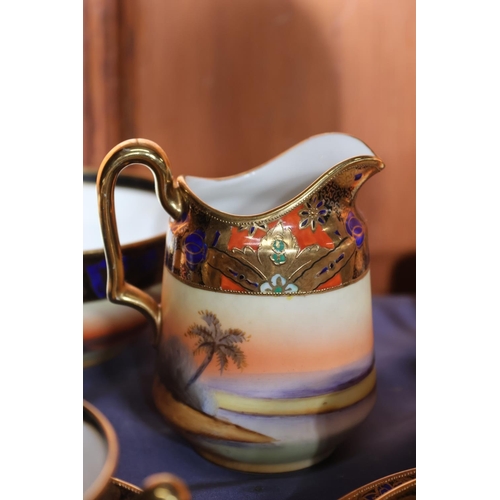 463 - Noritake of Japan, a thirty-eight piece bone china tea set decorated with Indian scenes depicting an... 