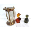 Two glass duck paperweights each 14cm and large hour glass timer. (3)