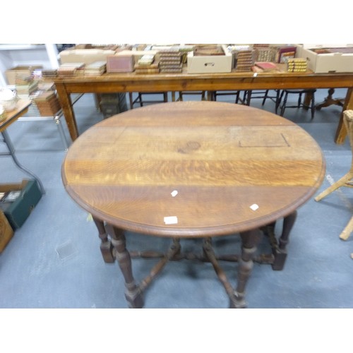 Antique oak double gate leg dining table with plank top.