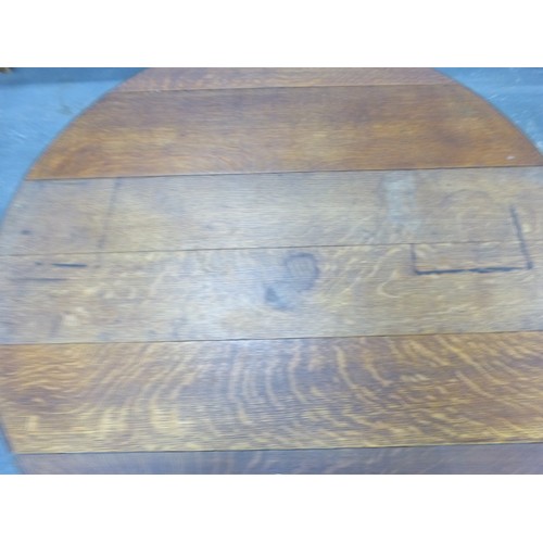 Antique oak double gate leg dining table with plank top.