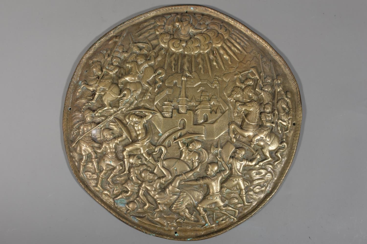 Antique cast bronze circular plaque depicting warriors fighting before ...