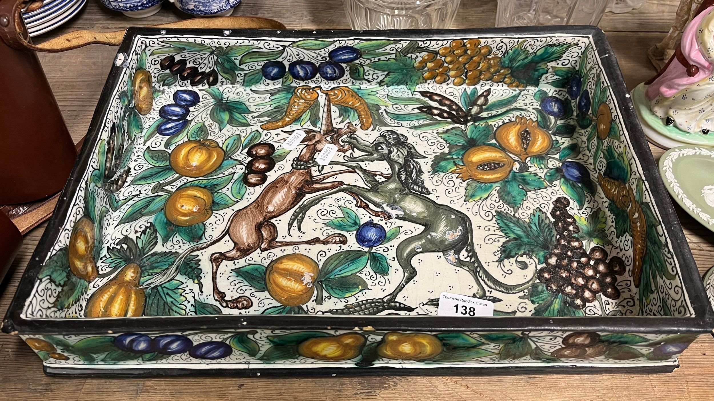 A Majolica style rectangular tray, decorated with mythical beasts ...