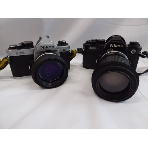 215 - Nikon FM2 SLR cameras, flash unit, video converter lens etc