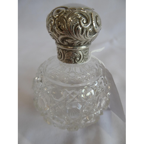 43 - Silver topped cut glass scent bottle - Chester 1898