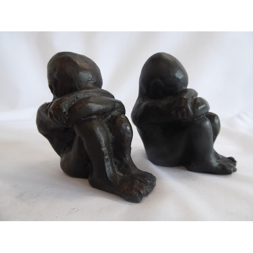 61 - Bronze figures in the form of a child in foetus or sulking posture  (2)