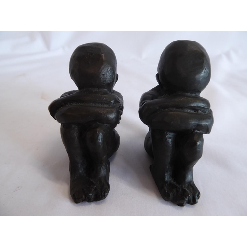 61 - Bronze figures in the form of a child in foetus or sulking posture  (2)