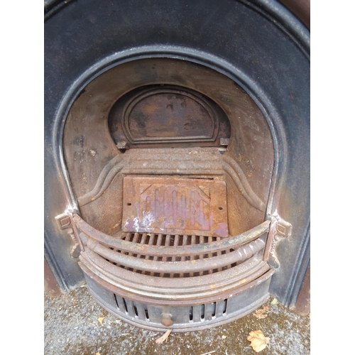 10 - Cast iron arched fireplace