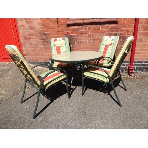 4 - Circular metal glass top garden table and 4 chairs with cushions