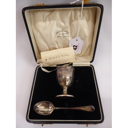 42 - Cased silver egg cup and spoon set - B'ham 1929 and cased silver spoon - Sheffield 1902 (2)