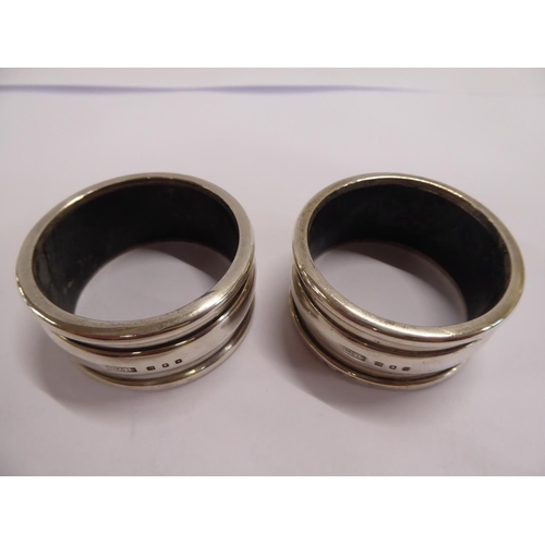 49 - Cased pair Britannia silver napkin rings BMC Ltd London 1928