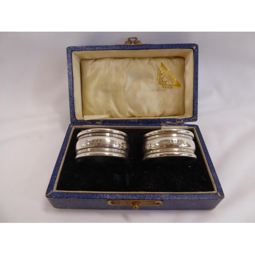 49 - Cased pair Britannia silver napkin rings BMC Ltd London 1928