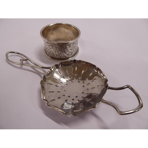 59 - Silver napkin ring and tea strainer (2)