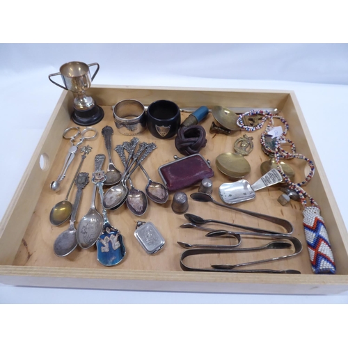 61 - Tray of miscellaneous - brass spoons, napkin rings, African beaded scent bottle, silver thimbles etc... 