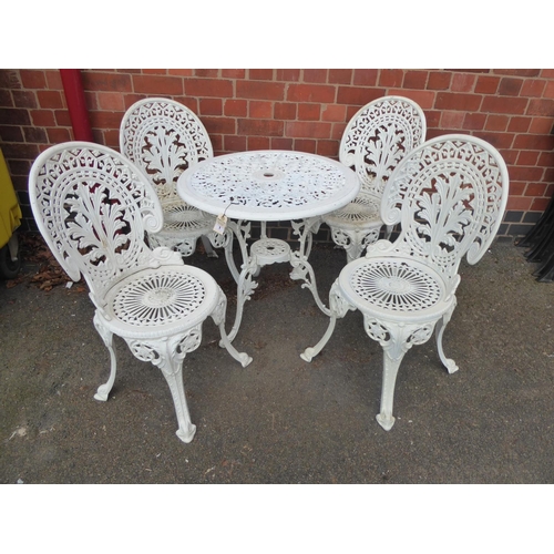 1 - Cast patio table and 4 chairs