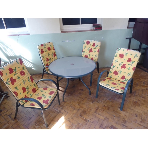 5 - Circular glass top garden table, 4 chairs and cushions