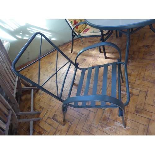 5 - Circular glass top garden table, 4 chairs and cushions