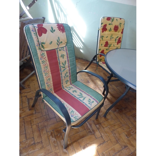 5 - Circular glass top garden table, 4 chairs and cushions