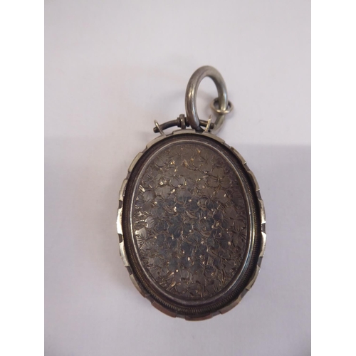 61 - Silver pocket watch on chain and white metal locket