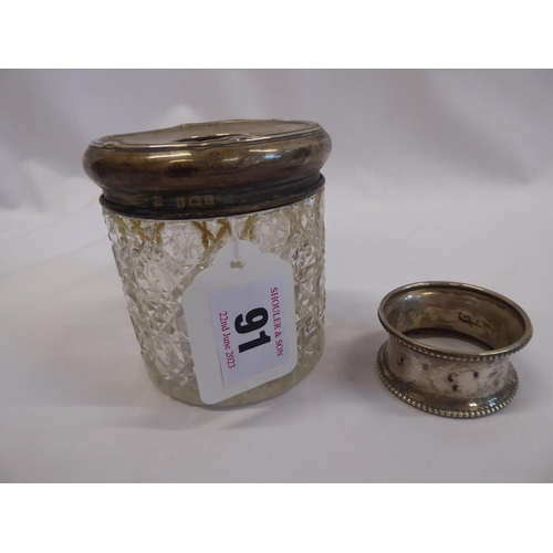 91 - Silver top cut glass hat pin jar and a napkin ring