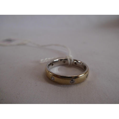 16 - 18ct yellow and white gold diamond set band ring (one stone missing) (4.4g)
