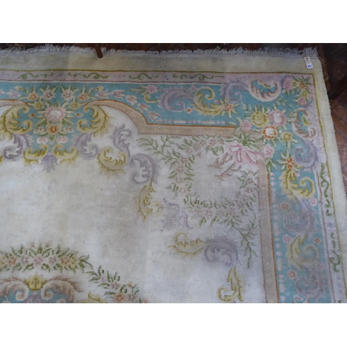 651 - Indian cream ground woollen carpet (142