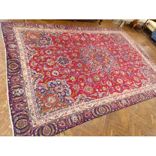575 - Red and blue ground Persian Mashad carpet (151