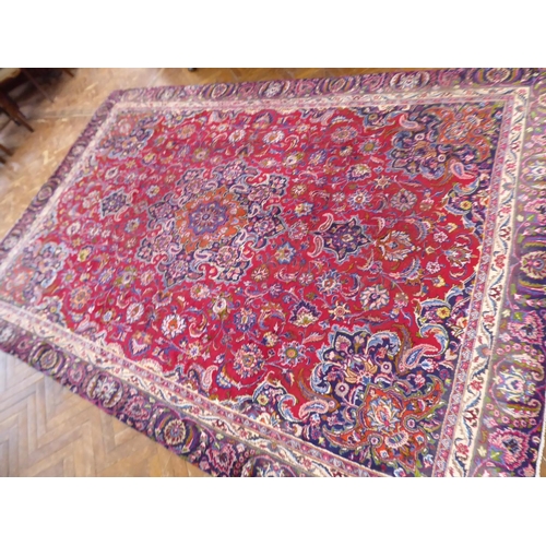 575 - Red and blue ground Persian Mashad carpet (151