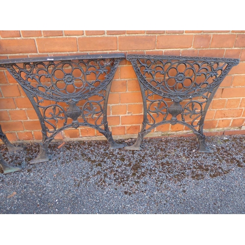 13 - Pair of cast iron garden bench ends with lion mask motif and pair table ends