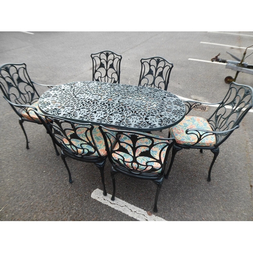 2 - Ornate cast garden table and 6 chairs (with cushions)