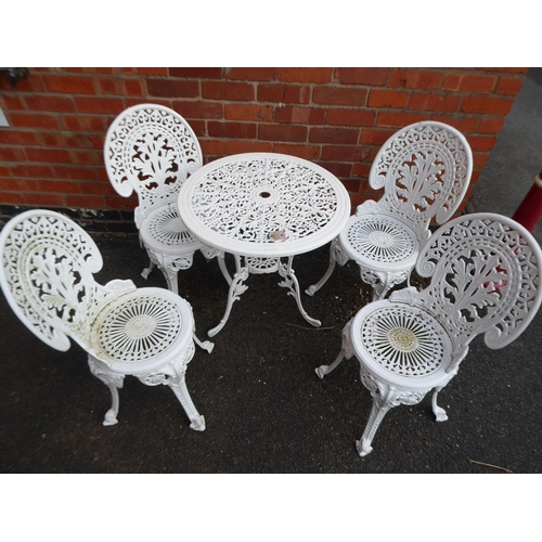 3 - Ornate cast patio table and 4 chairs