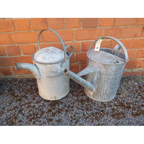 38 - Galvanised watering cans and buckets, stainless steel milk bucket and enamel jug (5)