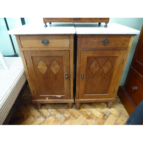 Pair of early 20thC French oak bedside cabinets with marble tops