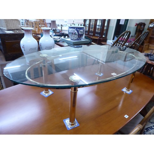 528 - Large oval brass base glass top coffee table