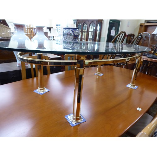 528 - Large oval brass base glass top coffee table