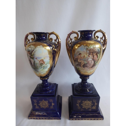 134 - Pair of Vienna type cobalt blue porcelain vases on plinths with nymph panels titled Ruby and Pearl -... 