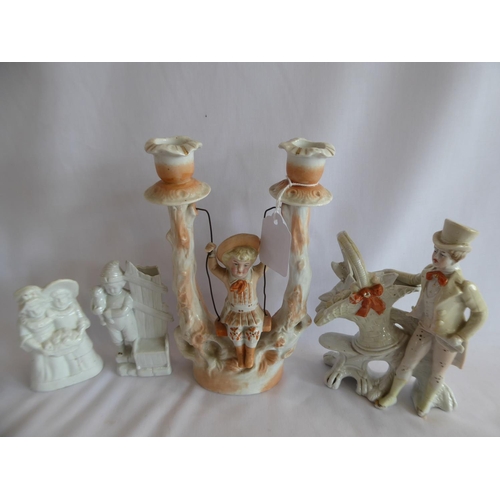 143 - 19thC continental porcelain figures, child on swing candlestick, spill vase etc. (7)