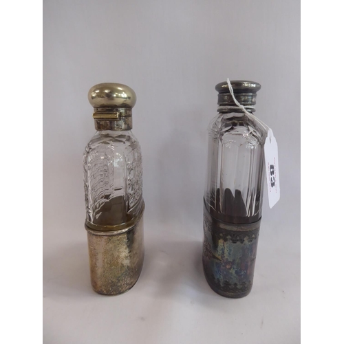 83 - Silver plated glass hip flasks (2)