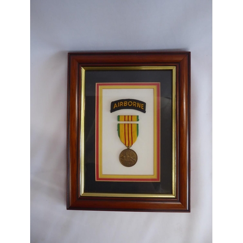93 - Framed German medals - Iron Cross 1813, Honour Cross 1914-1918, Iron Cross 1939 and a framed Vietnam... 