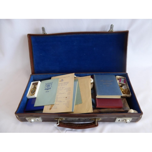98 - Leather Lodge Mason's briefcase and contents - gold plated orb, gilt medallions, apron, books etc.