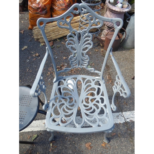 38 - Pair of painted cast patio chairs and stool