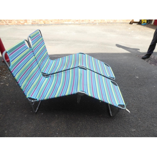 39 - Pair of striped folding sunlounger beds