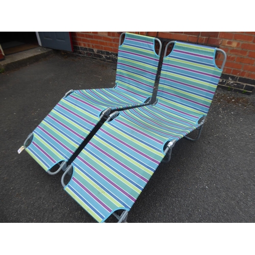 39 - Pair of striped folding sunlounger beds