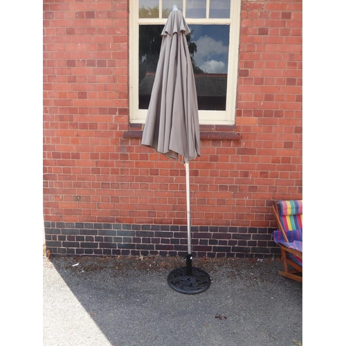 47 - Wind out parasol and cast iron base