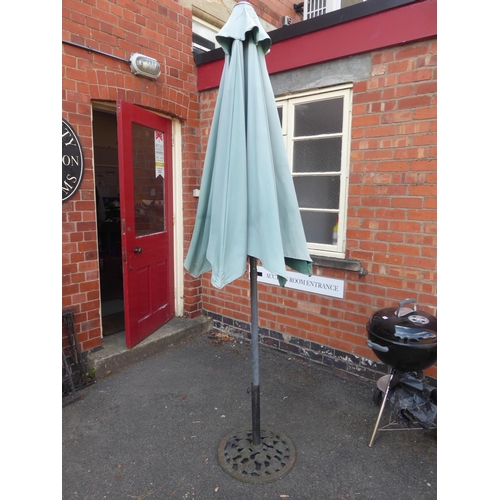 48 - Wind out parasol and cast iron base