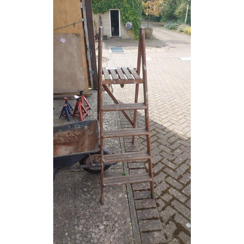 23 - Wheel barrow and step ladder