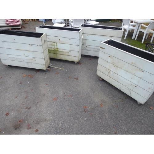 24 - Painted wooden oblong planters on castors (4)