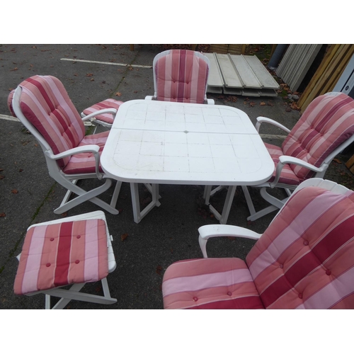 31 - Heavy duty white plastic folding garden table and chairs, cushions and parasol, side tables
