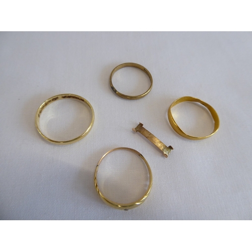 39 - 22ct gold wedding band (1.3g) and 3 other gold rings (5g)