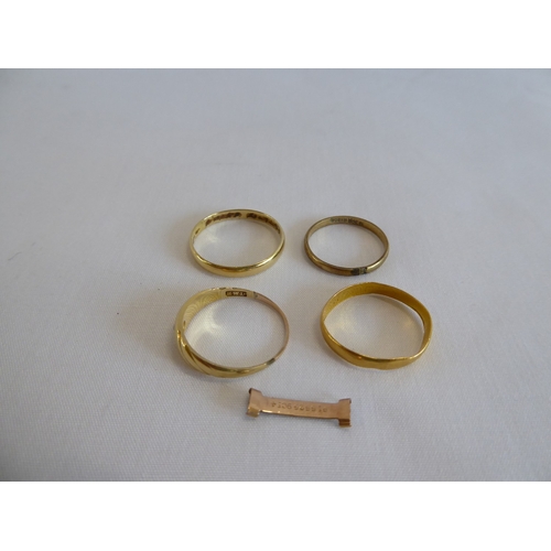 39 - 22ct gold wedding band (1.3g) and 3 other gold rings (5g)